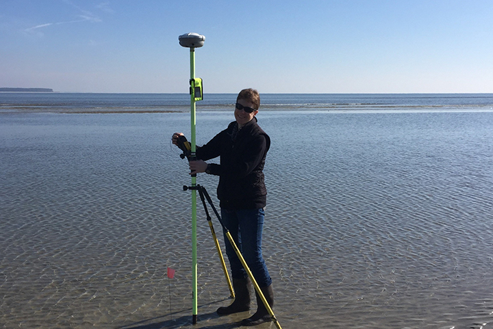 SCDNR Biologist Sharleen Johnson using a RTK GPS to measure elevation of piping plover habitat on Hilton Head Island