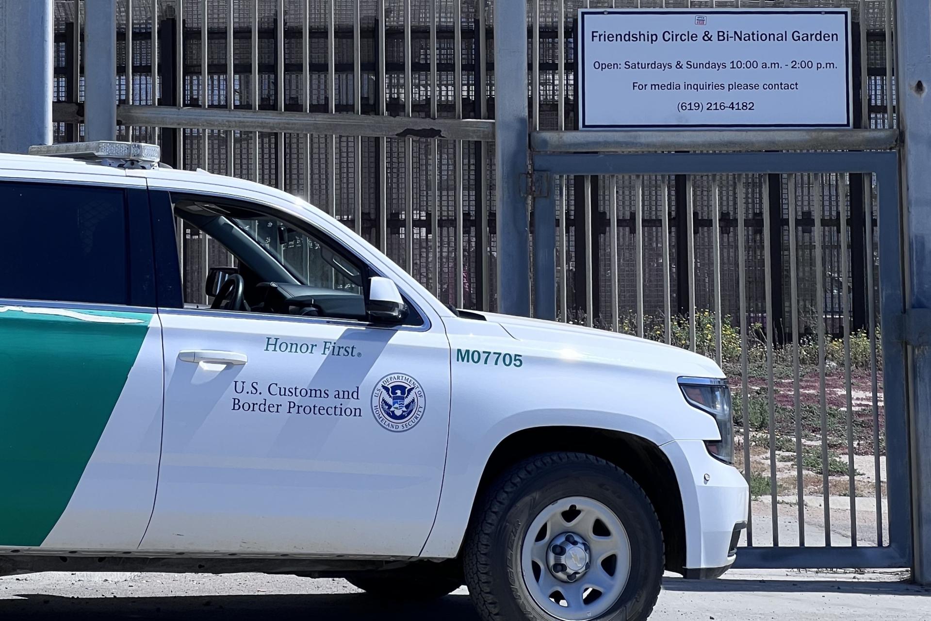 Border Patrol Vehicle policing garden fence.