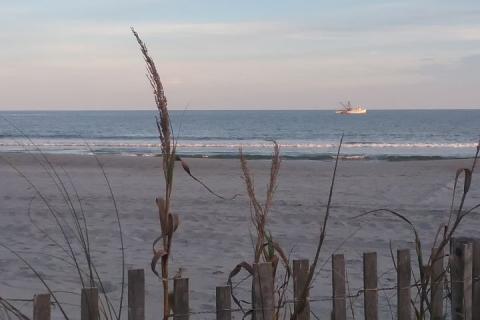 A commercial trawler heads back to port after fishing for shrimp along the north coast of South Carolina.